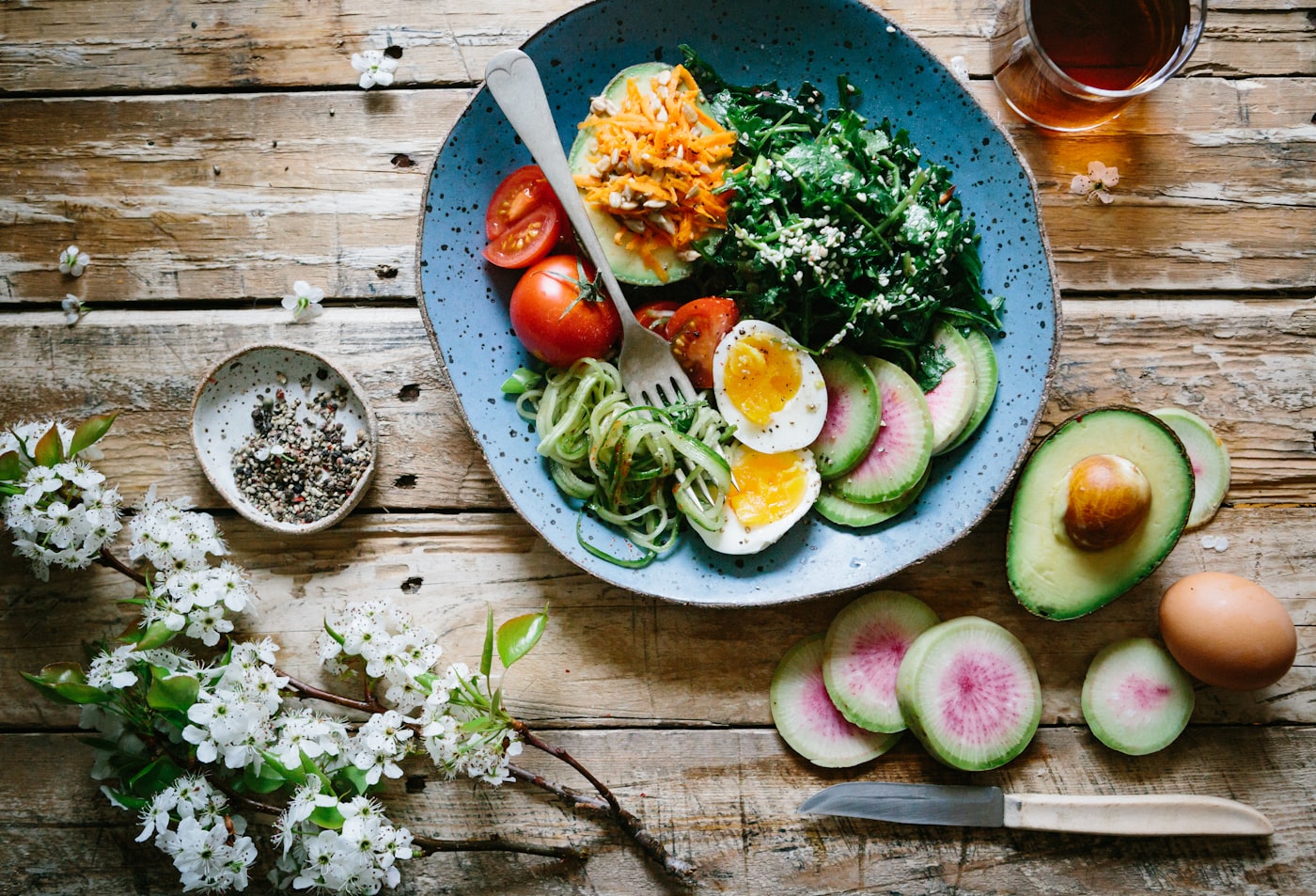 Overhead view of a nutrient dense meal with vegetables, eggs and avocado